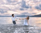 Wedding couple having fun in the sea