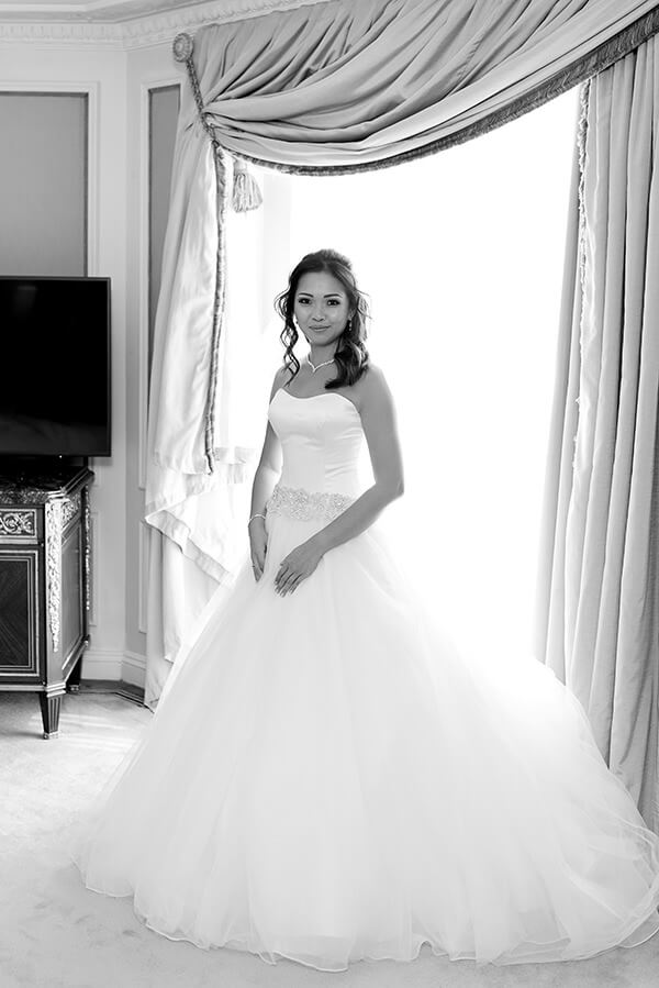 Bride posing with her wedding dress at The Bentley Hotel
